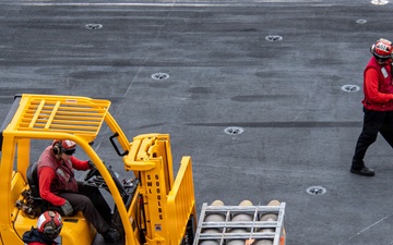 USS Carl Vinson (CVN 70) conducts ammunition onload