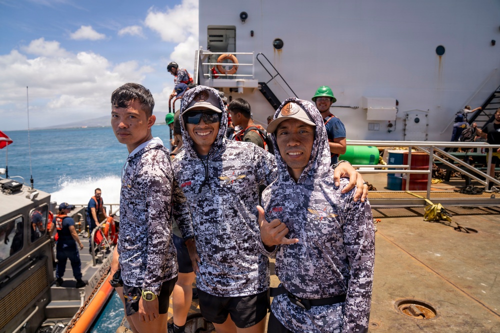 Partner nations participate in a buoy restoration project during RIMPAC 26
