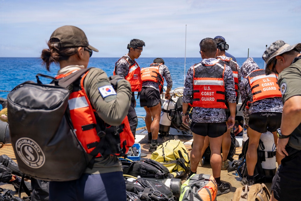 Partner nations participate in a buoy restoration project during RIMPAC 26