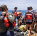 Partner nations participate in a buoy restoration project during RIMPAC 26