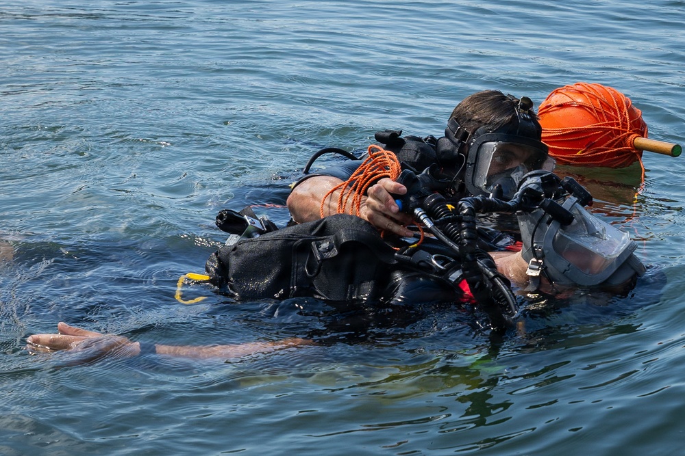oyal Navy Clearance Diver Conducts Routine Casualty Drill at Sea Breeze 26