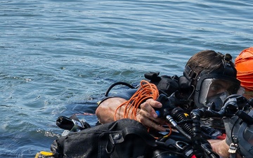 oyal Navy Clearance Diver Conducts Routine Casualty Drill at Sea Breeze 26