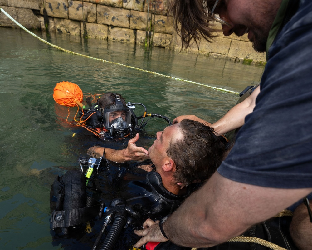 Royal Navy Clearance Diver Conducts Routine Casualty Drill at Sea Breeze 26