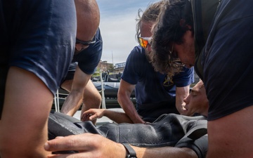 Royal Navy Clearance Diver Conducts Routine Casualty Drill at Sea Breeze 26