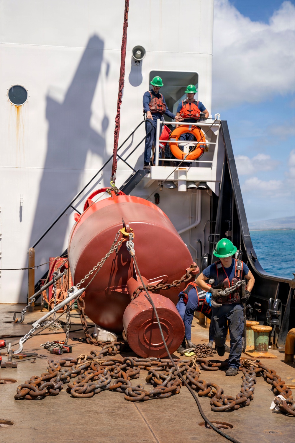 Partner nations participate in a buoy restoration project during RIMPAC 26