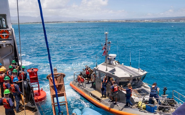 Partner nations participate in a buoy restoration project during RIMPAC 26