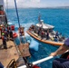 Partner nations participate in a buoy restoration project during RIMPAC 26