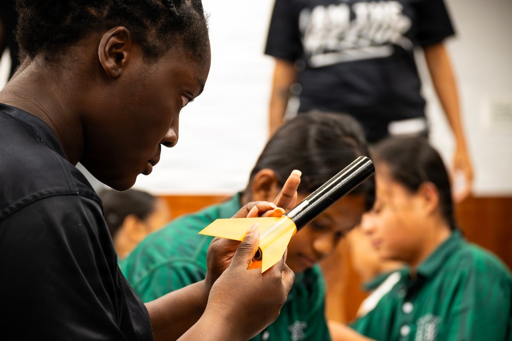 94th Army Air and Missile Defense Command Soldiers assist YIP student athletes with rocket building