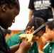 94th Army Air and Missile Defense Command Soldiers assist YIP student athletes with rocket building