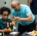 94th Army Air and Missile Defense Command Soldiers assist YIP student athletes with rocket building
