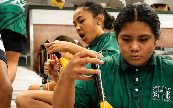 94th Army Air and Missile Defense Command Soldiers assist YIP stuident athletes with rocket building