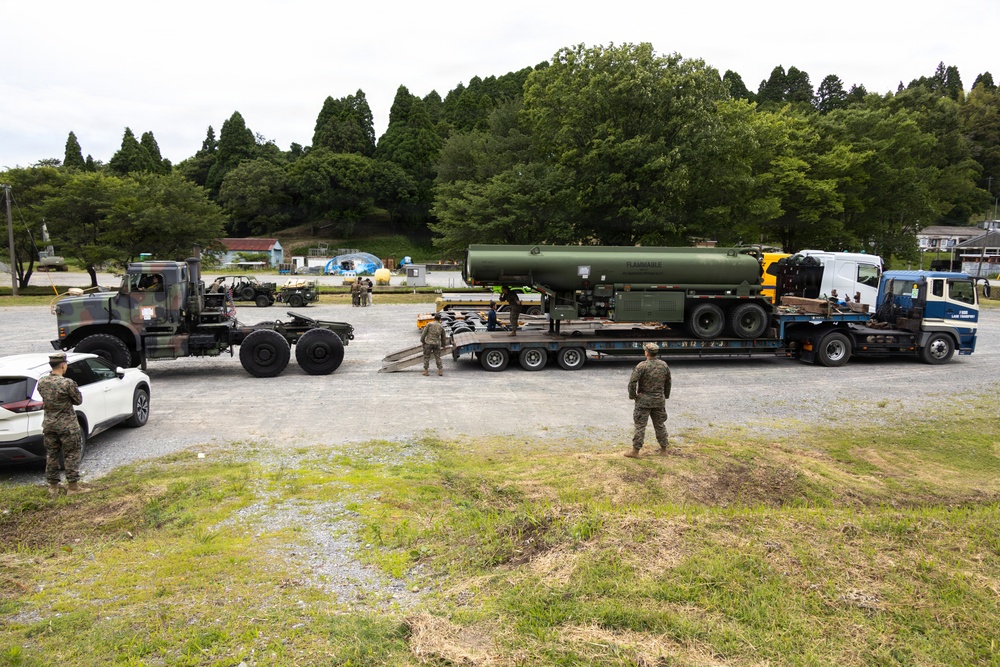 Marines with MWSS-171 unload tactical equipment