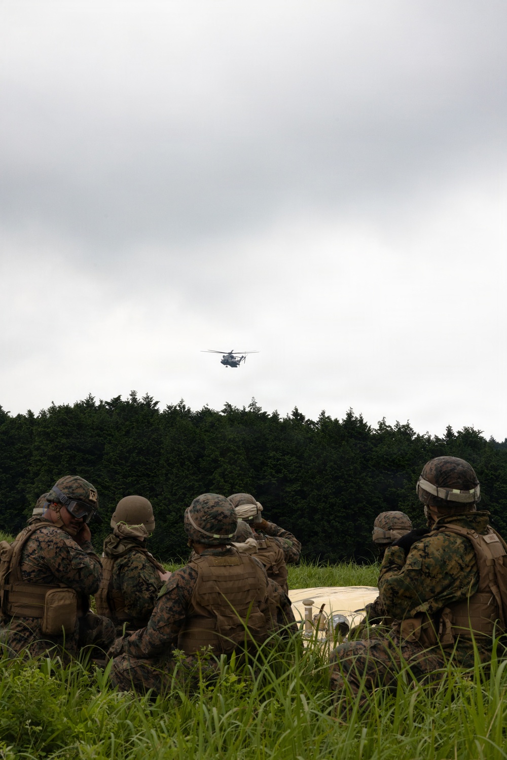 Helicopters land at a FARP site