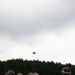 Helicopters land at a FARP site