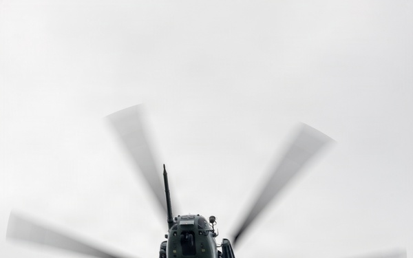 Helicopters land at a FARP site