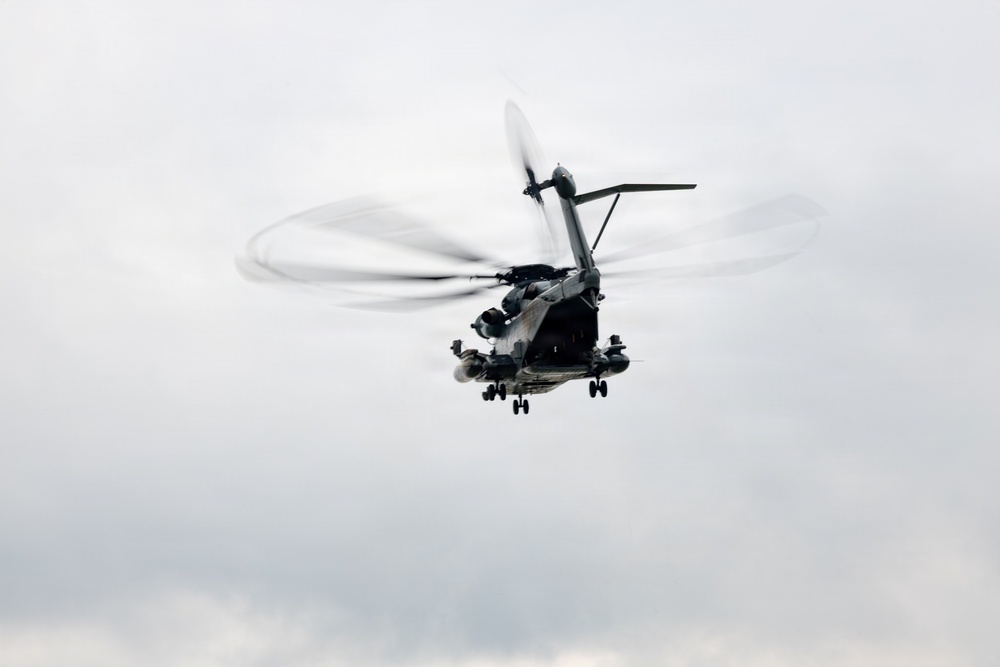 Helicopters land at a FARP site