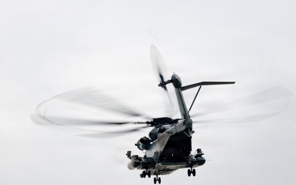 Helicopters land at a FARP site