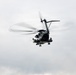 Helicopters land at a FARP site