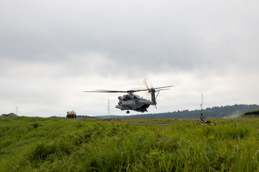 Helicopters land at a FARP site