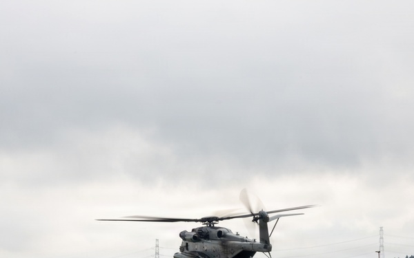 Helicopters land at a FARP site