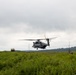 Helicopters land at a FARP site