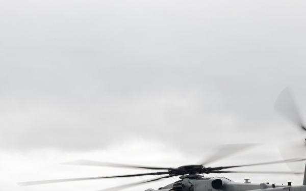 Helicopters land at a FARP site