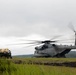 Helicopters land at a FARP site