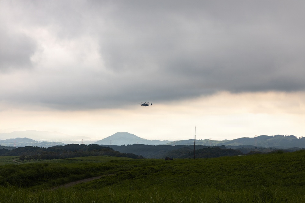Helicopters land at a FARP site