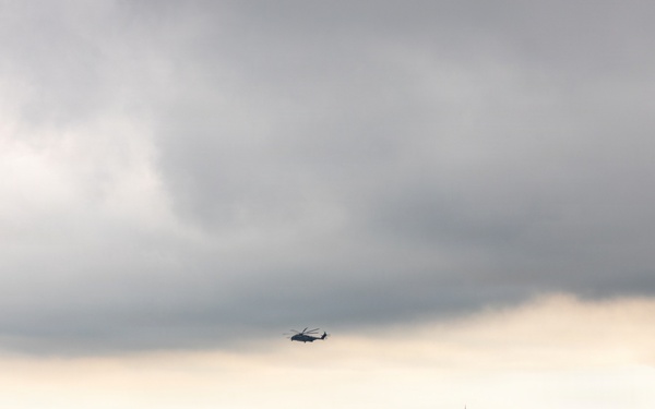 Helicopters land at a FARP site