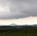 Helicopters land at a FARP site