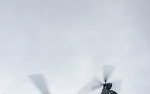 Helicopters land at a FARP site