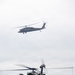 Helicopters land at a FARP site