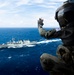 Multinational ships conduct a replenishment at sea during RIMPAC 2026