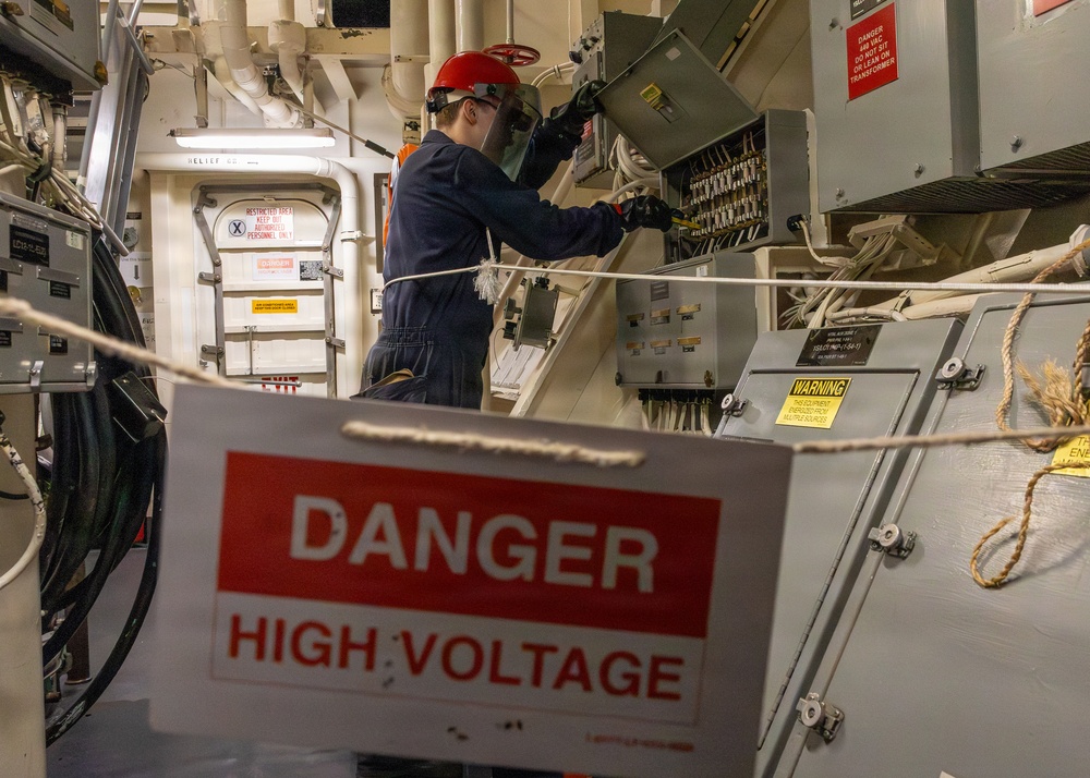 Navy Sailor Performs Electrical Maintenance Aboard U.S. Navy Vessel
