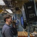 U.S. Navy Sailor Operates Console Aboard Naval Vessel