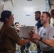 Pacific Partnership 2026 personnel embarked aboard Royal Australian Navy HMAS Choules (L100) move cargo during replenishment-at-sea