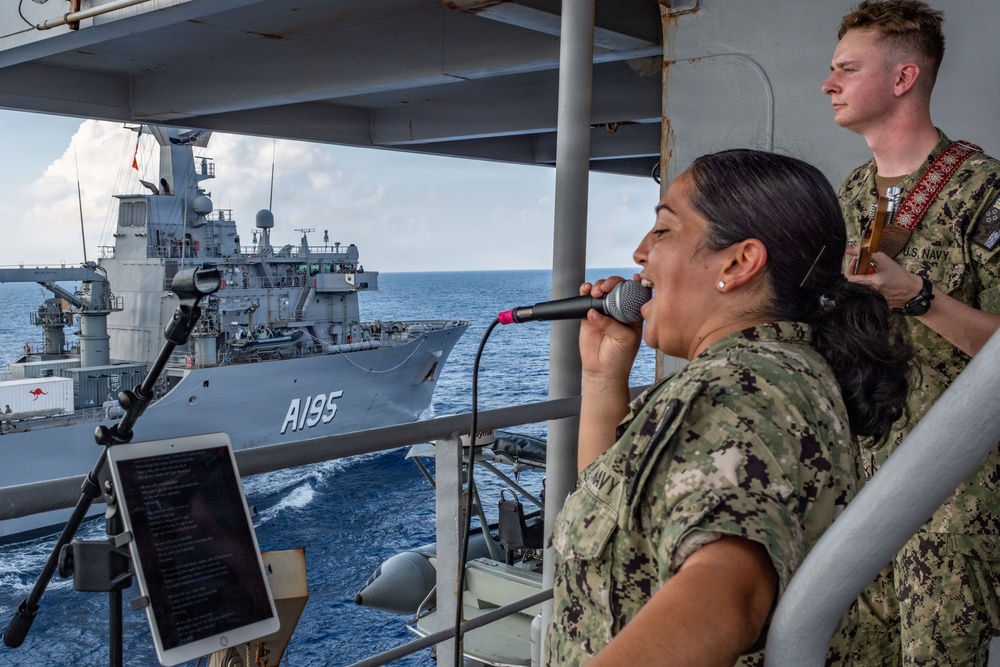 Pacific Partnership Band plays aboard Royal Australian Navy HMAS Choules (L100) during replenishment-at-sea