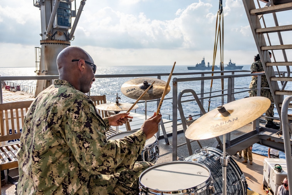 Pacific Partnership Band plays aboard Royal Australian Navy HMAS Choules (L100) during replenishment-at-sea