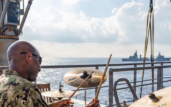 Pacific Partnership Band plays aboard Royal Australian Navy HMAS Choules (L100) during replenishment-at-sea