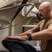 Sailor Operates Laundry Equipment Aboard Naval Vessel