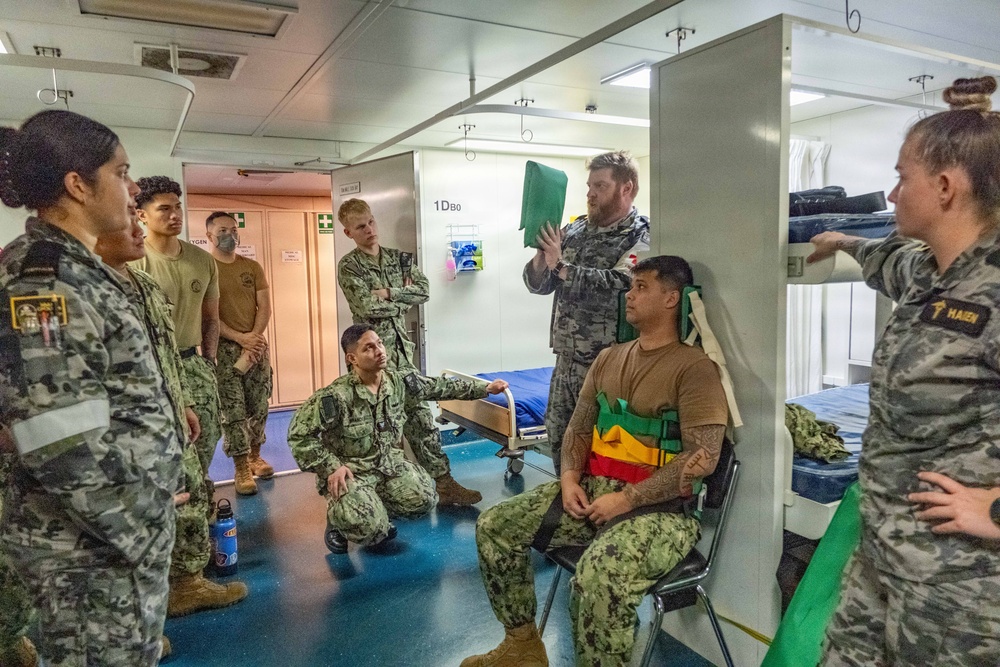 Royal Australian Navy medics train Pacific Partnership 2026 medical personnel on extrication device aboard HMAS Choules (L100)