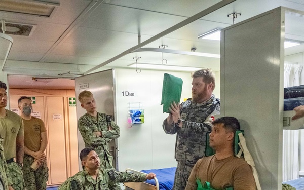 Royal Australian Navy medics train Pacific Partnership 2026 medical personnel on extrication device aboard HMAS Choules (L100)
