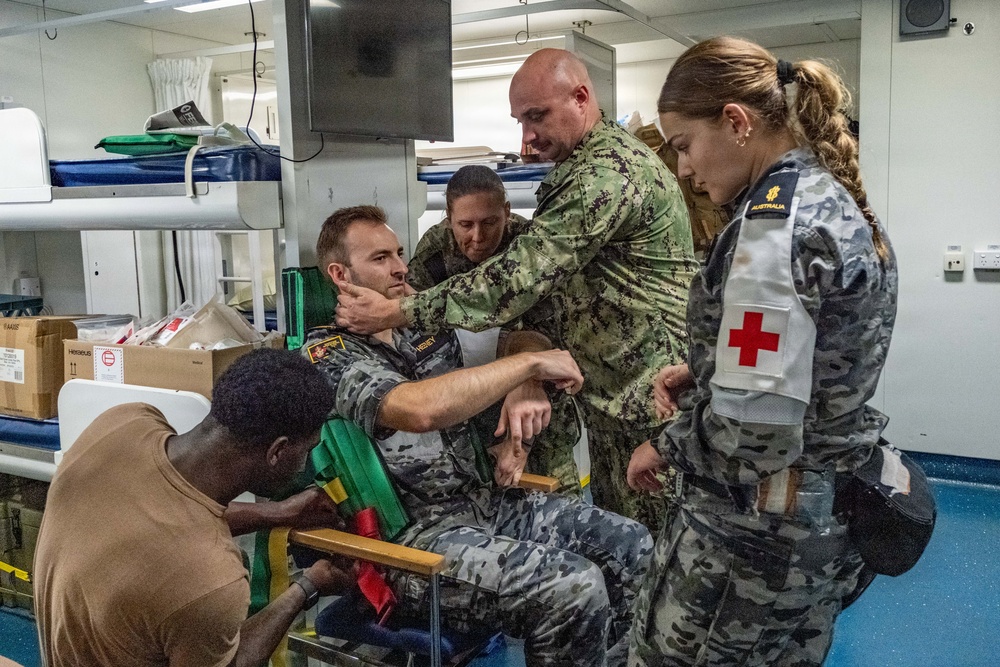 Royal Australian Navy medics train Pacific Partnership 2026 medical personnel on extrication device aboard HMAS Choules (L100)