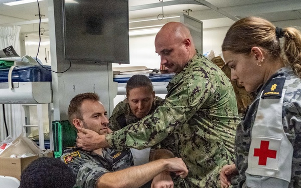 Royal Australian Navy medics train Pacific Partnership 2026 medical personnel on extrication device aboard HMAS Choules (L100)