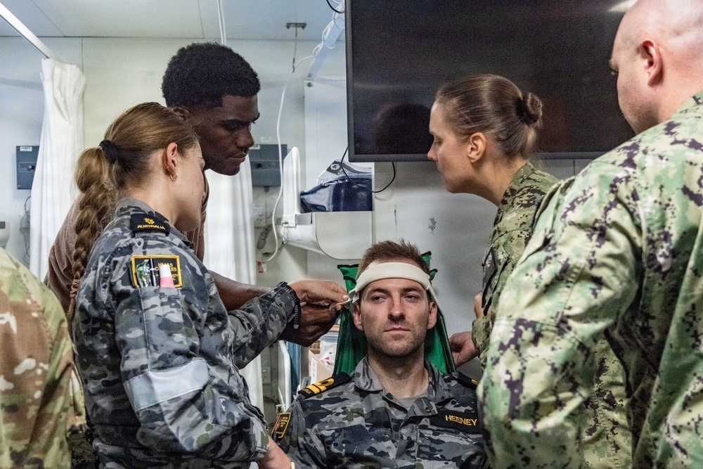 Royal Australian Navy medics train Pacific Partnership 2026 medical personnel on extrication device aboard HMAS Choules (L100)