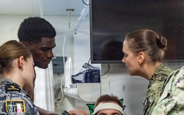 Royal Australian Navy medics train Pacific Partnership 2026 medical personnel on extrication device aboard HMAS Choules (L100)