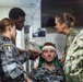 Royal Australian Navy medics train Pacific Partnership 2026 medical personnel on extrication device aboard HMAS Choules (L100)