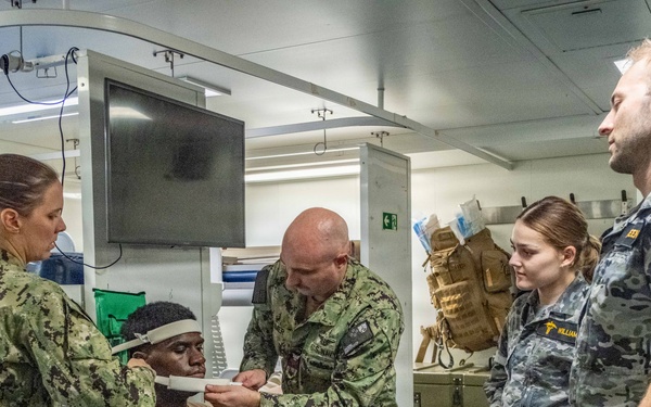Royal Australian Navy medics train Pacific Partnership 2026 medical personnel on extrication device aboard HMAS Choules (L100)