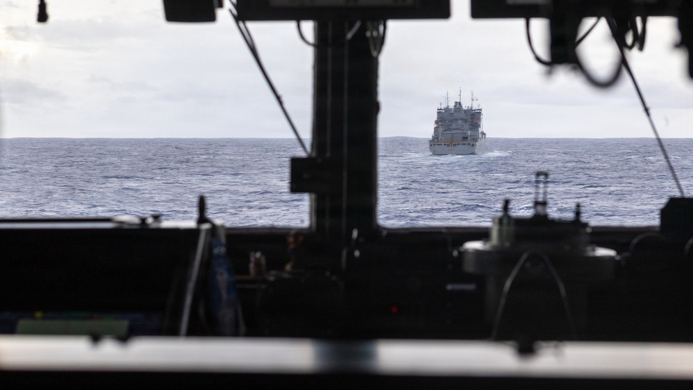 USS Mustin conducts a replenishment-at-sea with USNS Carl Brashear