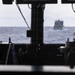 USS Mustin conducts a replenishment-at-sea with USNS Carl Brashear